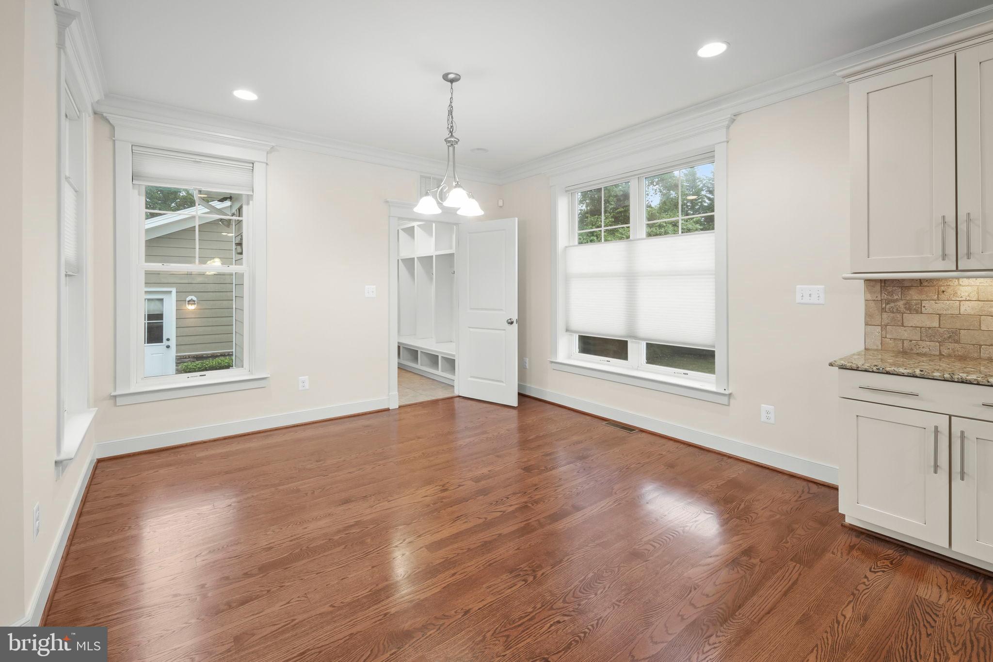 217 Pleasant Street Southwest Vienna, VA 22180 - Photo 45 of 80 a view of an empty room with a window and wooden floor