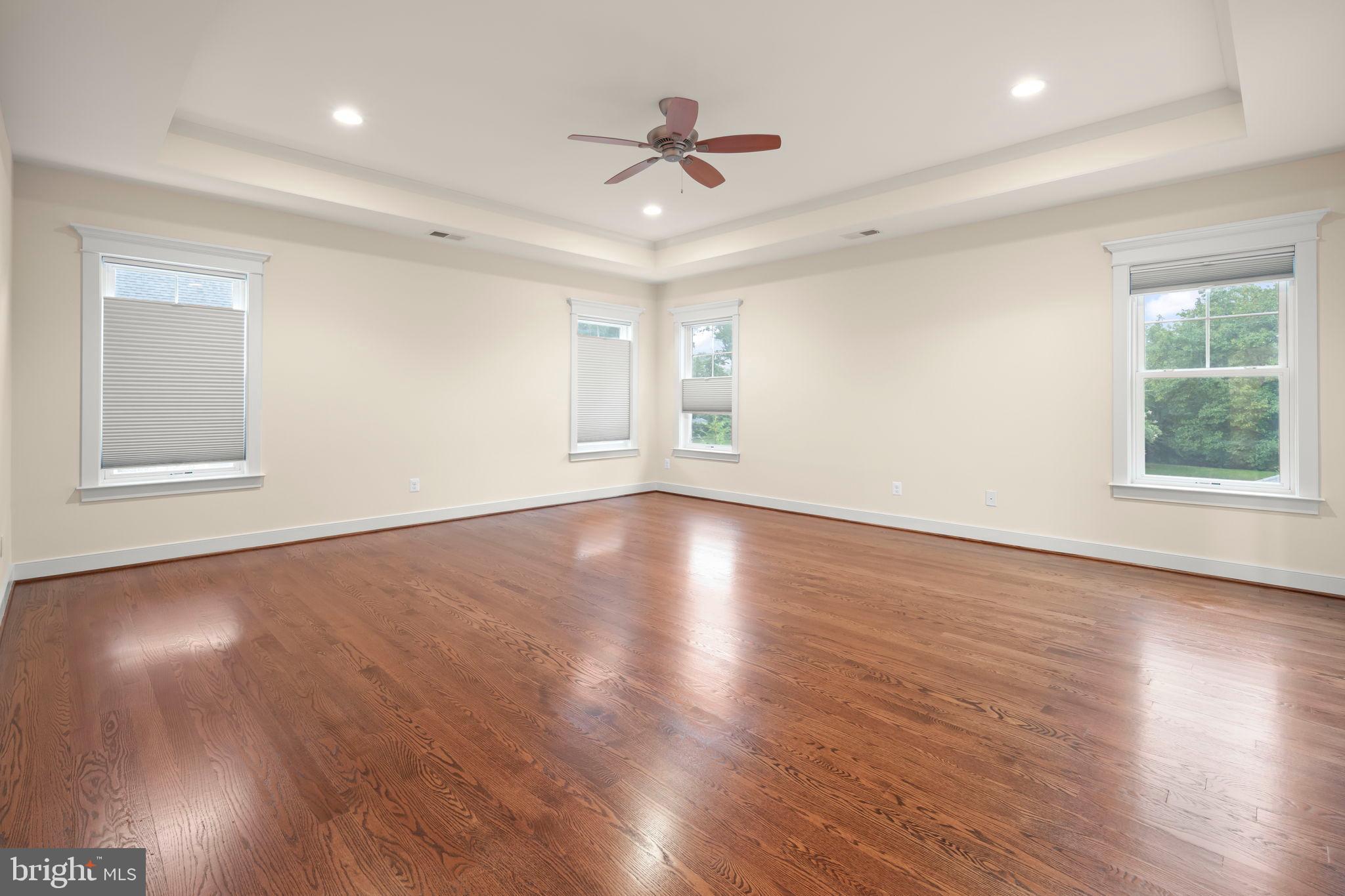 217 Pleasant Street Southwest Vienna, VA 22180 - Photo 51 of 80 a view of an empty room with wooden floor and a window
