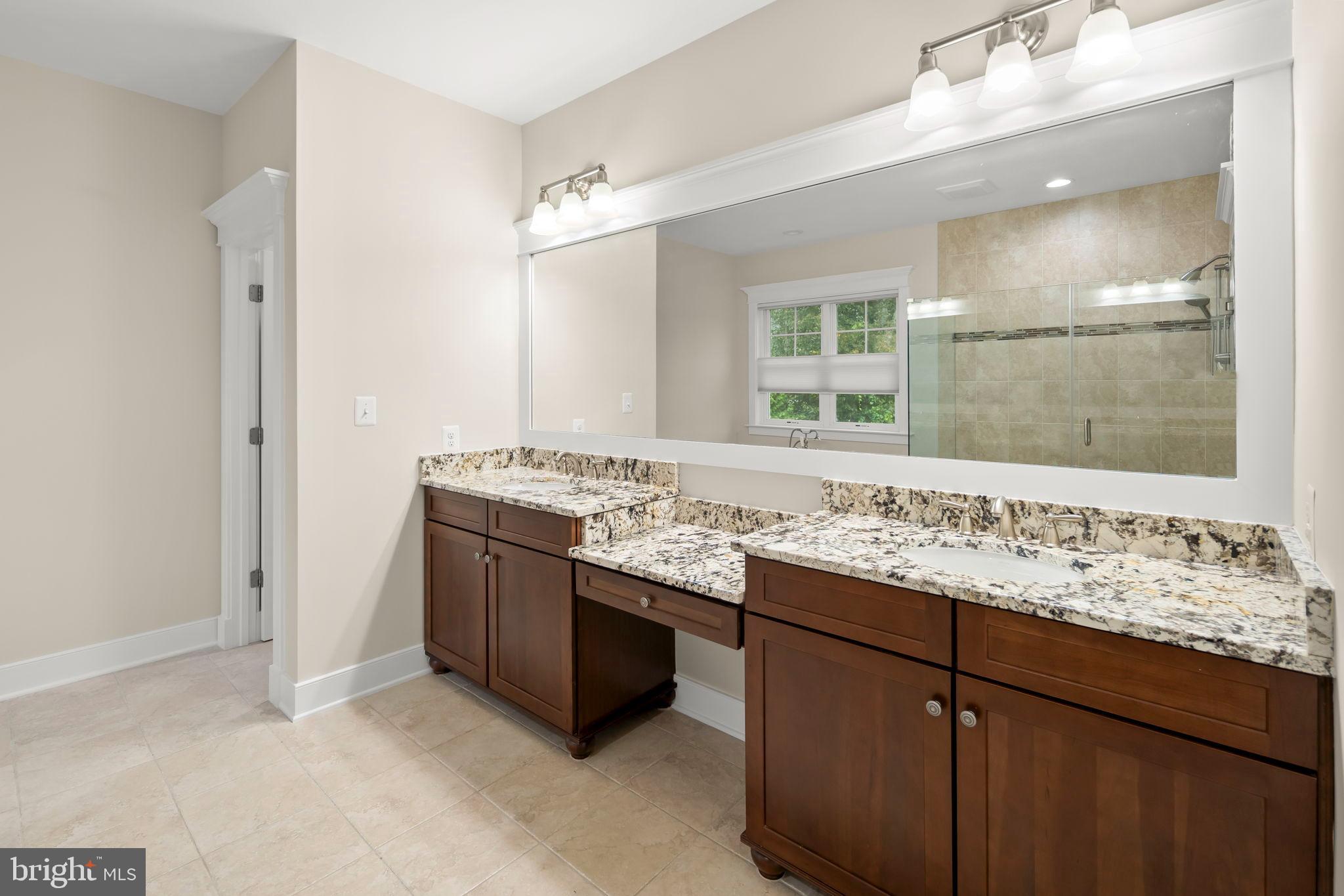 217 Pleasant Street Southwest Vienna, VA 22180 - Photo 53 of 80 a bathroom with a sink and a mirror