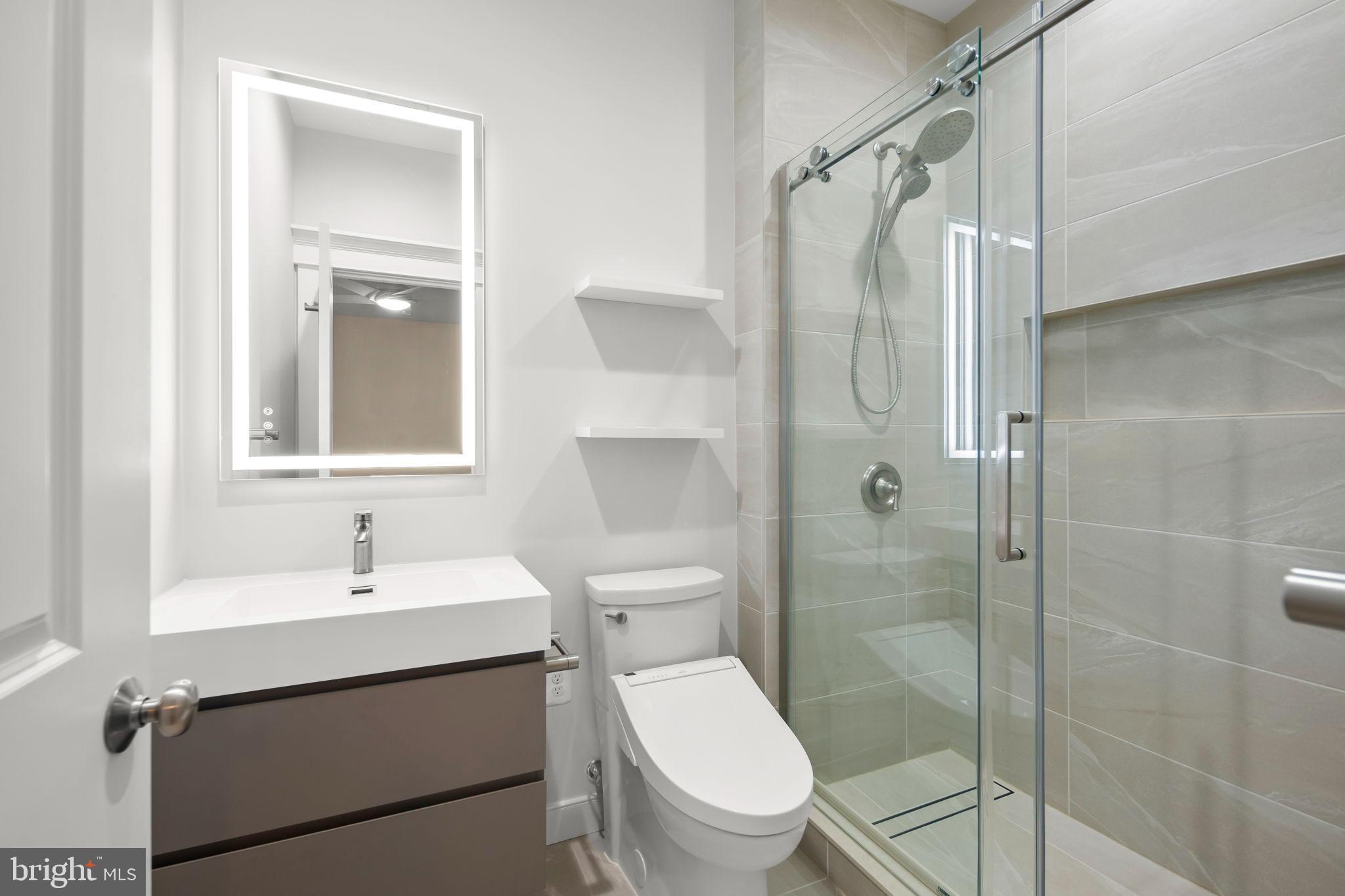 217 Pleasant Street Southwest Vienna, VA 22180 - Photo 64 of 80 a bathroom with a sink toilet and shower