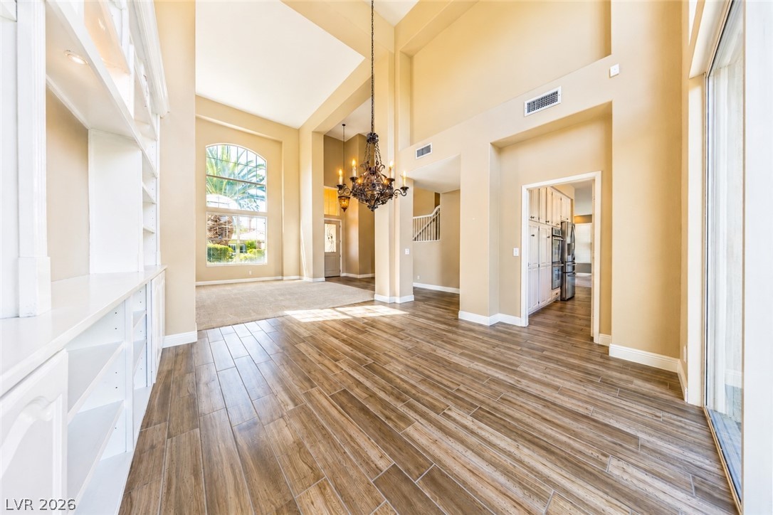 2504 Putting Green Drive Henderson, NV 89074 - Photo 11 of 56 This grand living space features towering ceilings and abundant natural light.