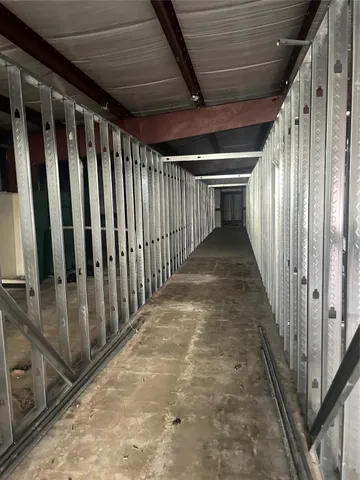 a living room with furniture and a lamp