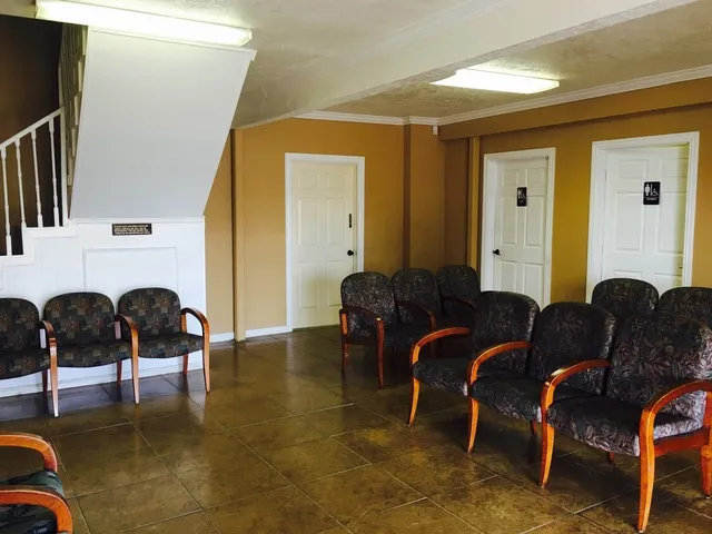 a room with a bed and a desk