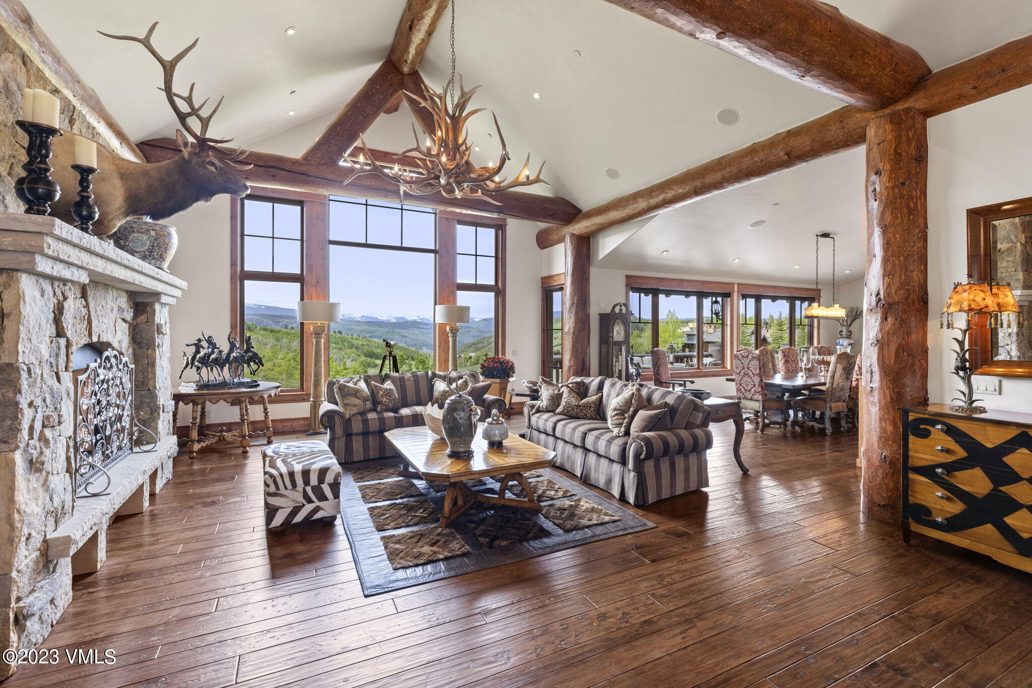 940 Summit Trail Edwards, CO 81632 - Photo 1 of 64 a very nice looking living room with furniture wooden floor and a chandelier