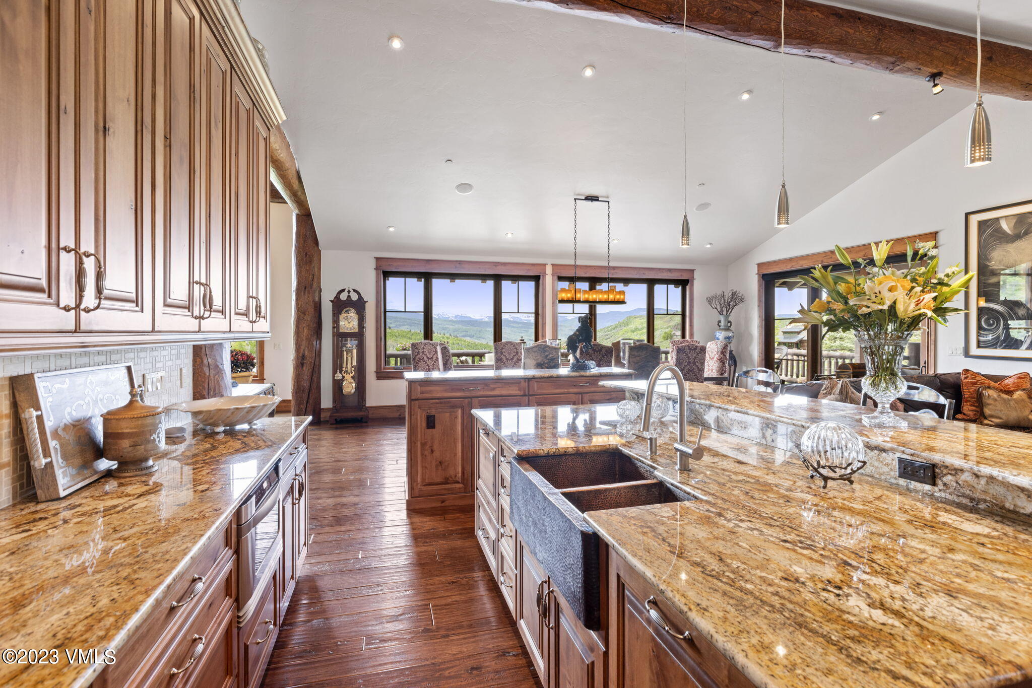 940 Summit Trail Edwards, CO 81632 - Photo 13 of 64 a kitchen with stainless steel appliances granite countertop a stove a sink dishwasher and cabinets with wooden floor