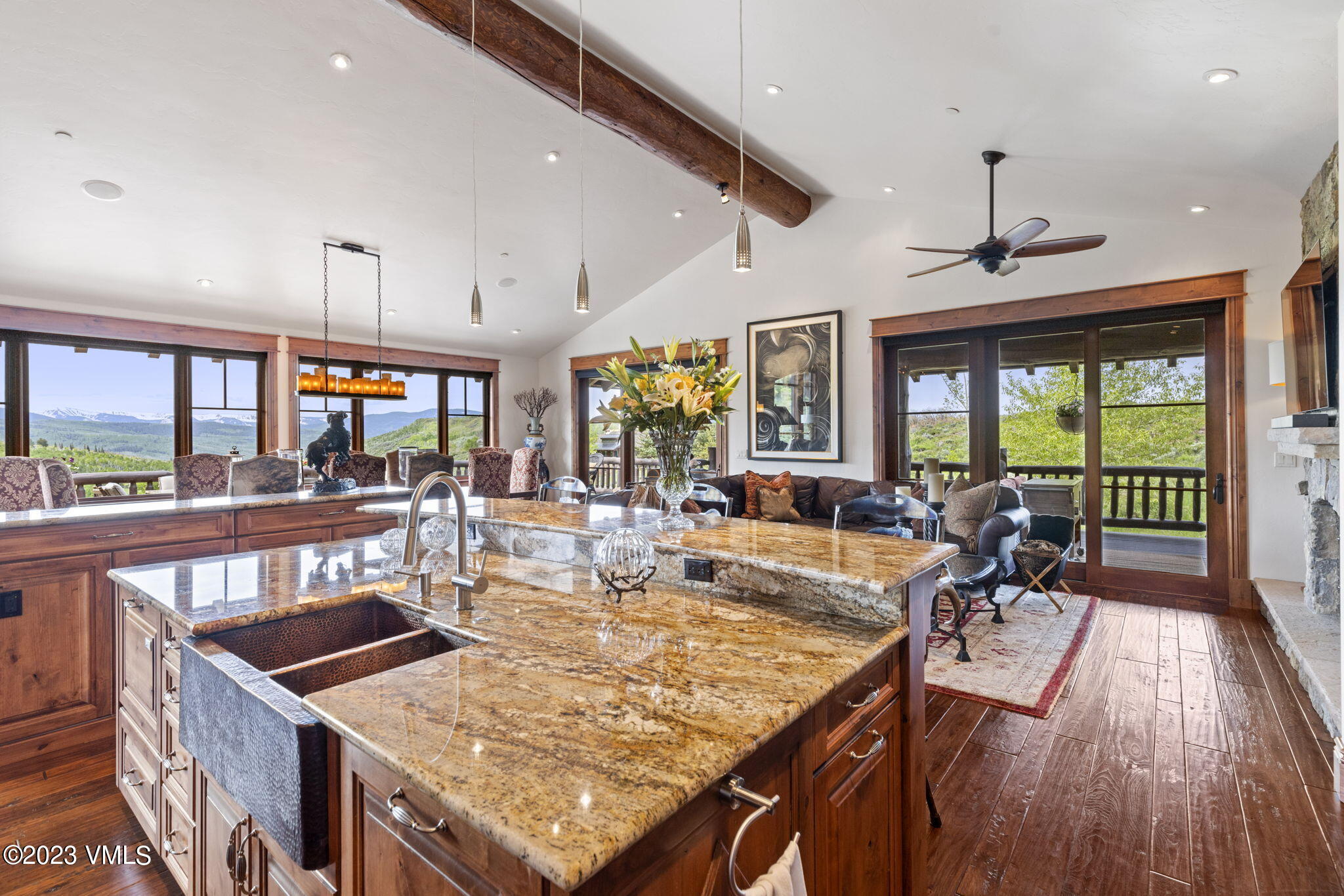 940 Summit Trail Edwards, CO 81632 - Photo 14 of 64 a view of a dining room with furniture large windows and wooden floor