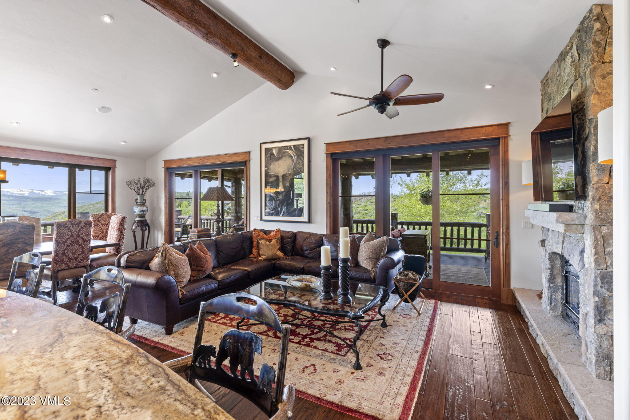 940 Summit Trail Edwards, CO 81632 - Photo 15 of 64 a living room with furniture floor to ceiling window and wooden floor