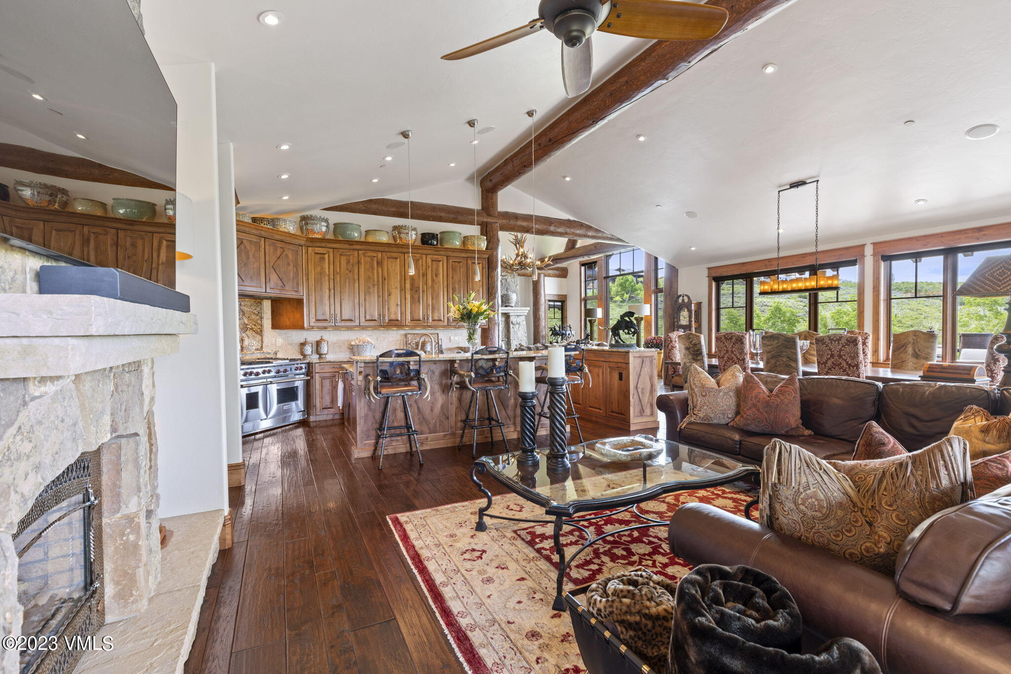 940 Summit Trail Edwards, CO 81632 - Photo 16 of 64 a living room with lots of furniture wooden floor and a fireplace
