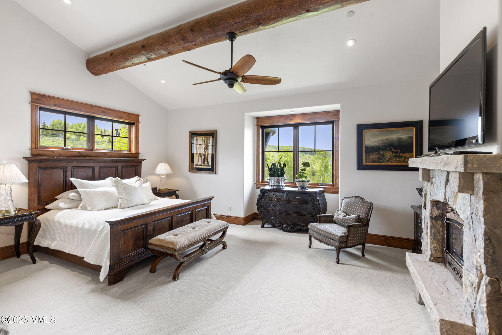 940 Summit Trail Edwards, CO 81632 - Photo 20 of 64 a bedroom with a bed a flat screen tv and a couch