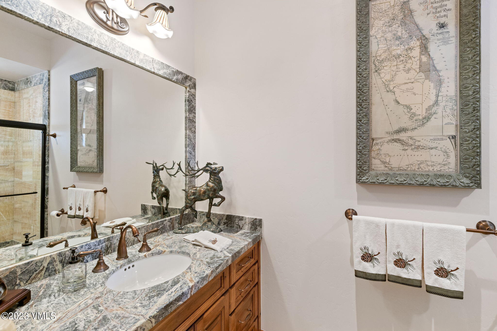 940 Summit Trail Edwards, CO 81632 - Photo 24 of 64 a bathroom with a granite countertop sink and a mirror