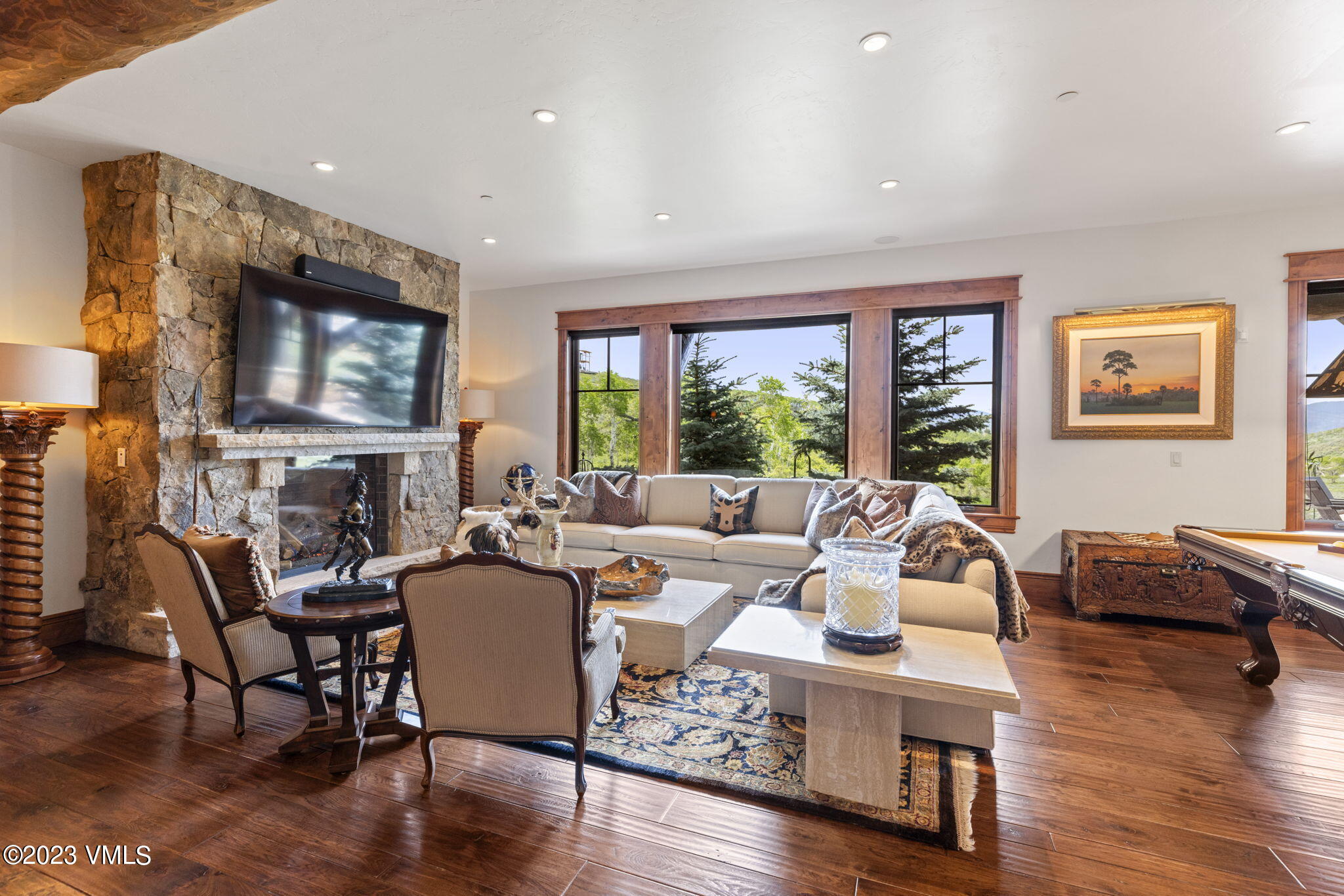 940 Summit Trail Edwards, CO 81632 - Photo 28 of 64 a living room with fireplace furniture and a flat screen tv