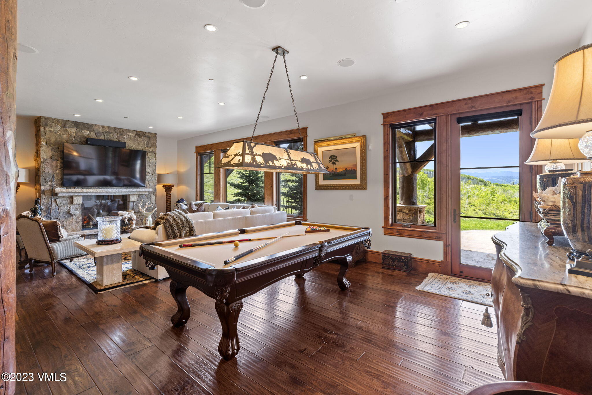 940 Summit Trail Edwards, CO 81632 - Photo 31 of 64 a living room with fireplace furniture and a flat screen tv