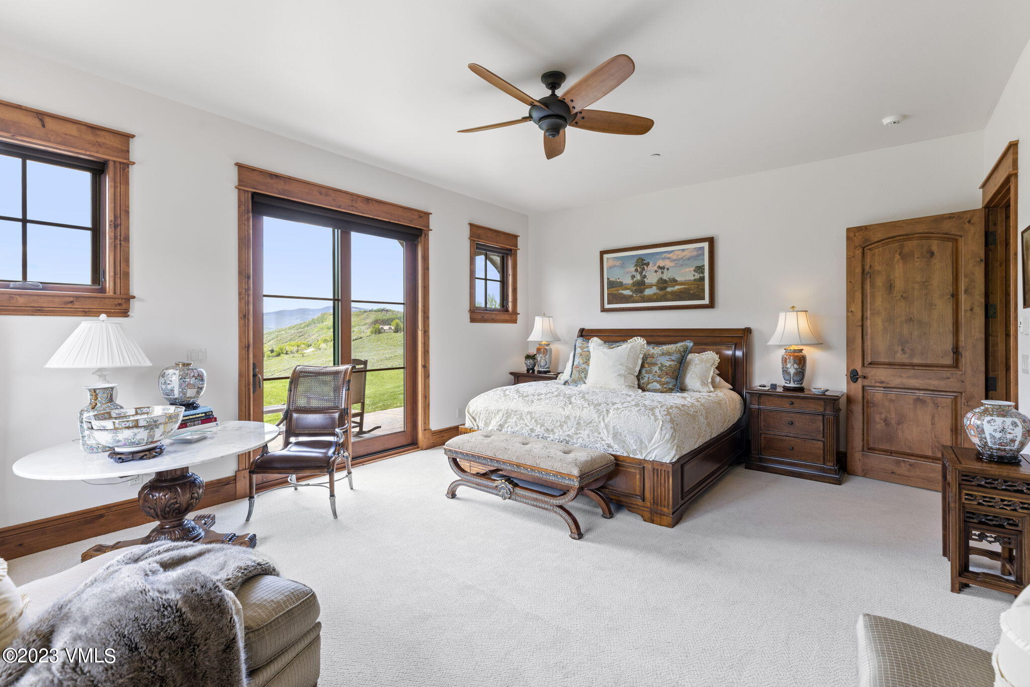 940 Summit Trail Edwards, CO 81632 - Photo 37 of 64 a spacious bedroom with a bed a couch and a window