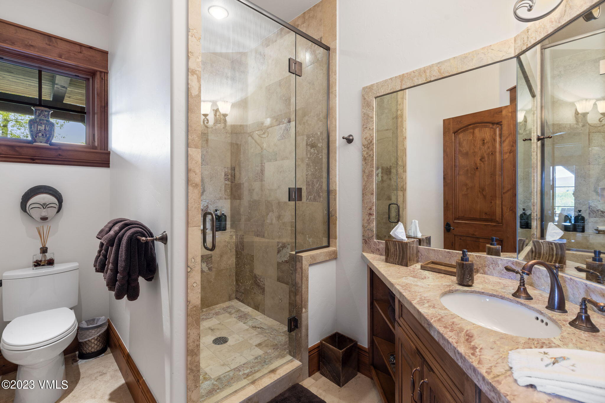 940 Summit Trail Edwards, CO 81632 - Photo 44 of 64 a bathroom with a granite countertop sink toilet and shower