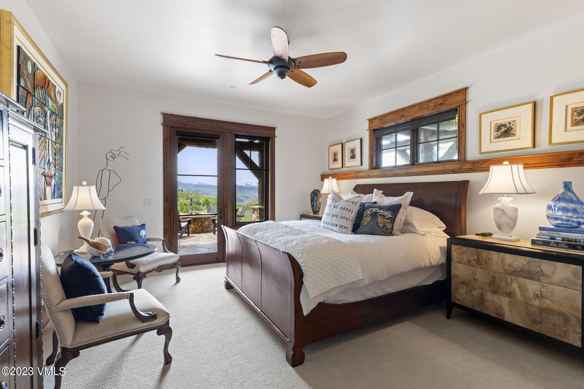 940 Summit Trail Edwards, CO 81632 - Photo 45 of 64 a bedroom with a bed couch and a large window