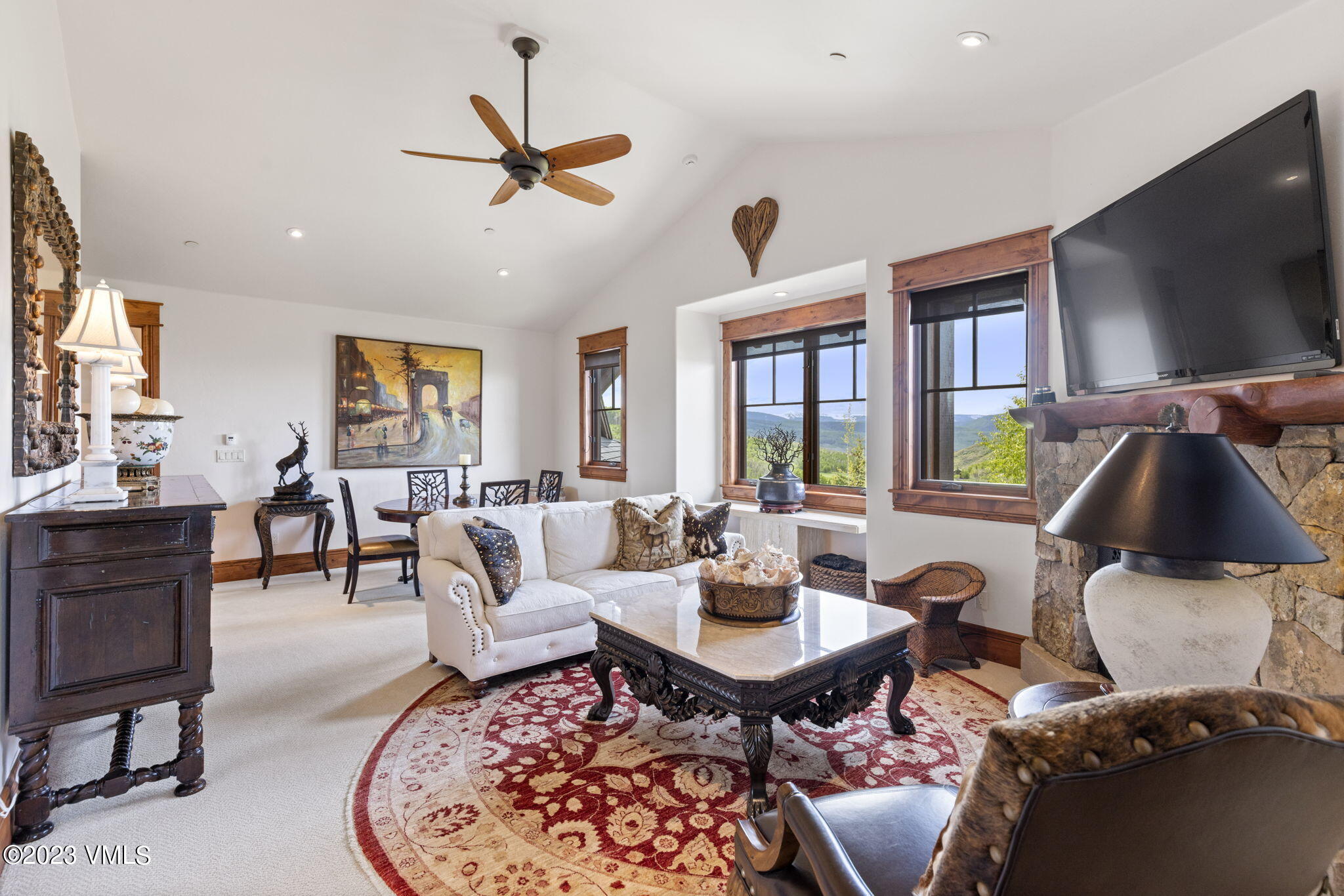 940 Summit Trail Edwards, CO 81632 - Photo 47 of 64 a living room with furniture a flat screen tv and a large window