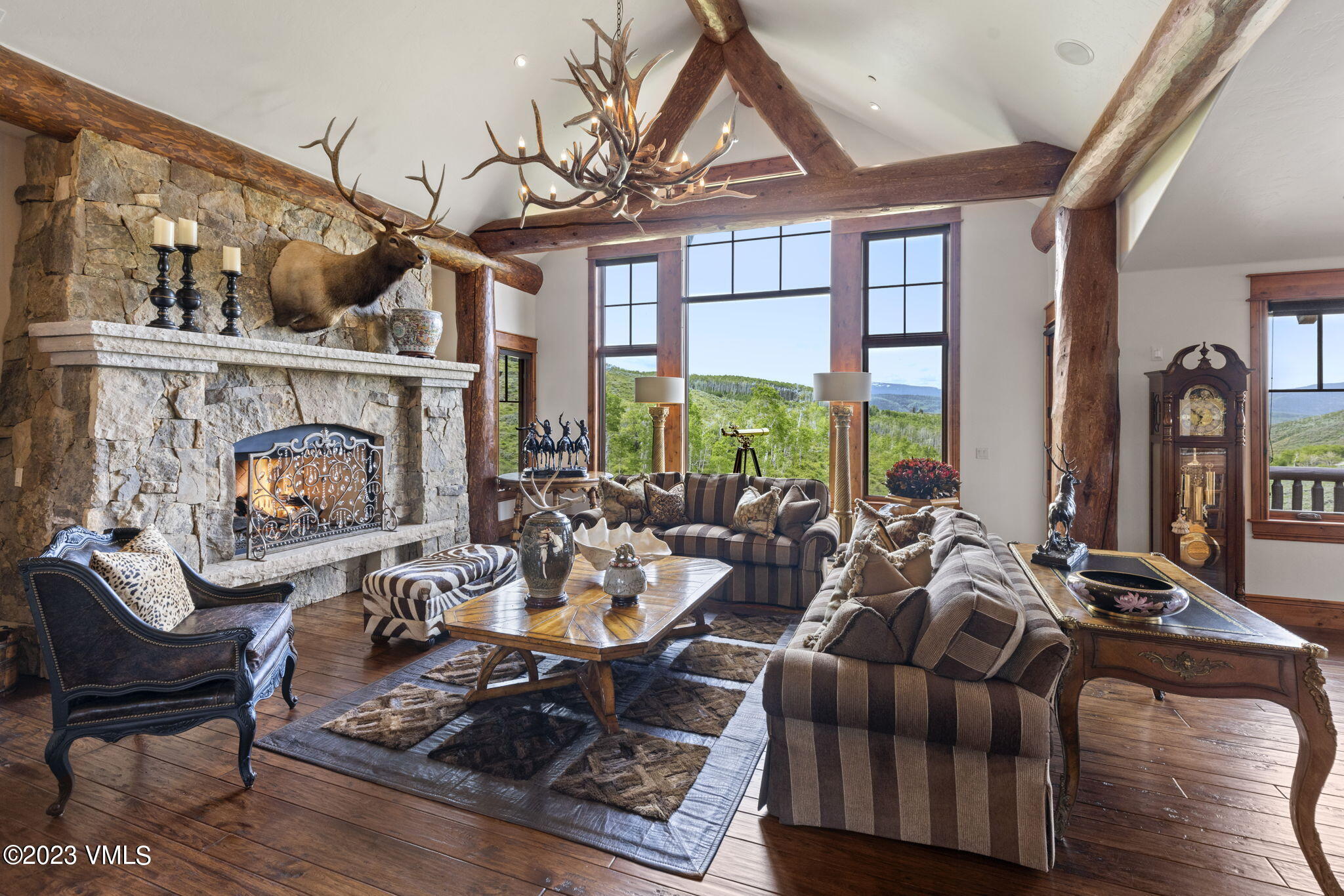 940 Summit Trail Edwards, CO 81632 - Photo 5 of 64 a living room with furniture fireplace and large windows