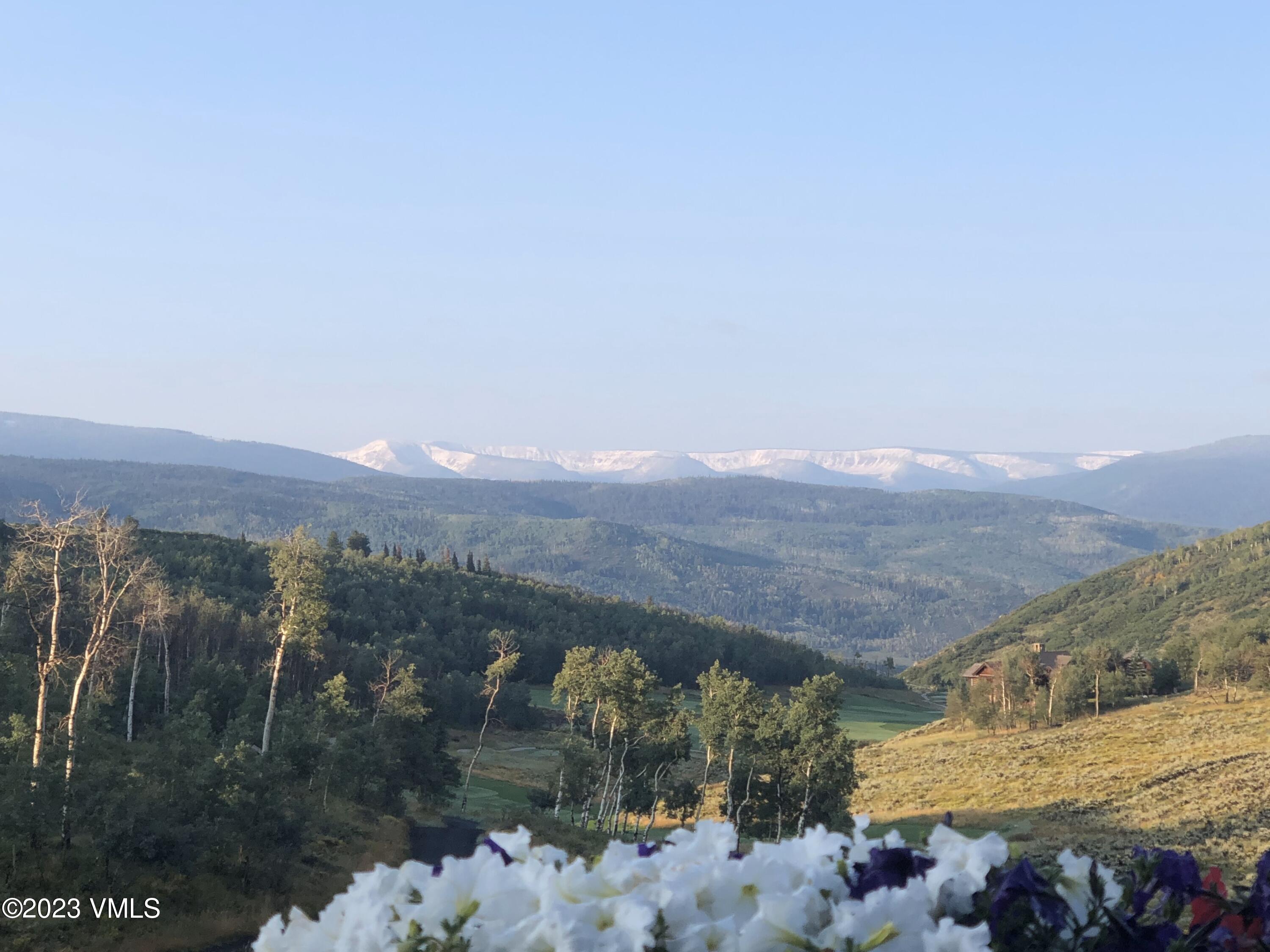 940 Summit Trail Edwards, CO 81632 - Photo 60 of 64 a view of a lake with a mountain in the background