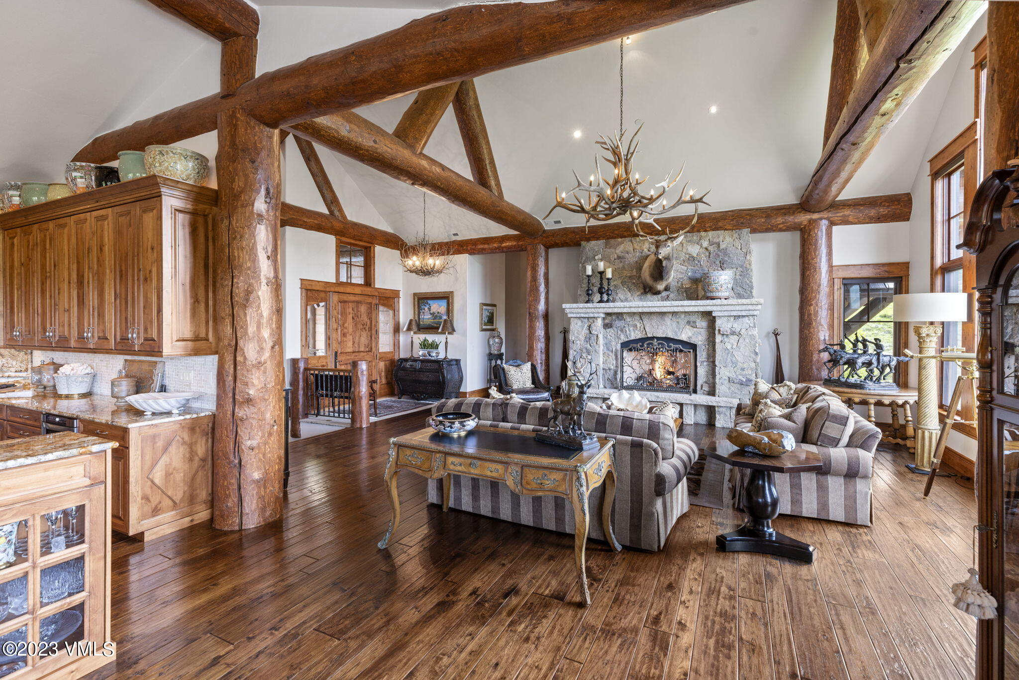 940 Summit Trail Edwards, CO 81632 - Photo 6 of 64 a living room with furniture a fireplace and wooden floor