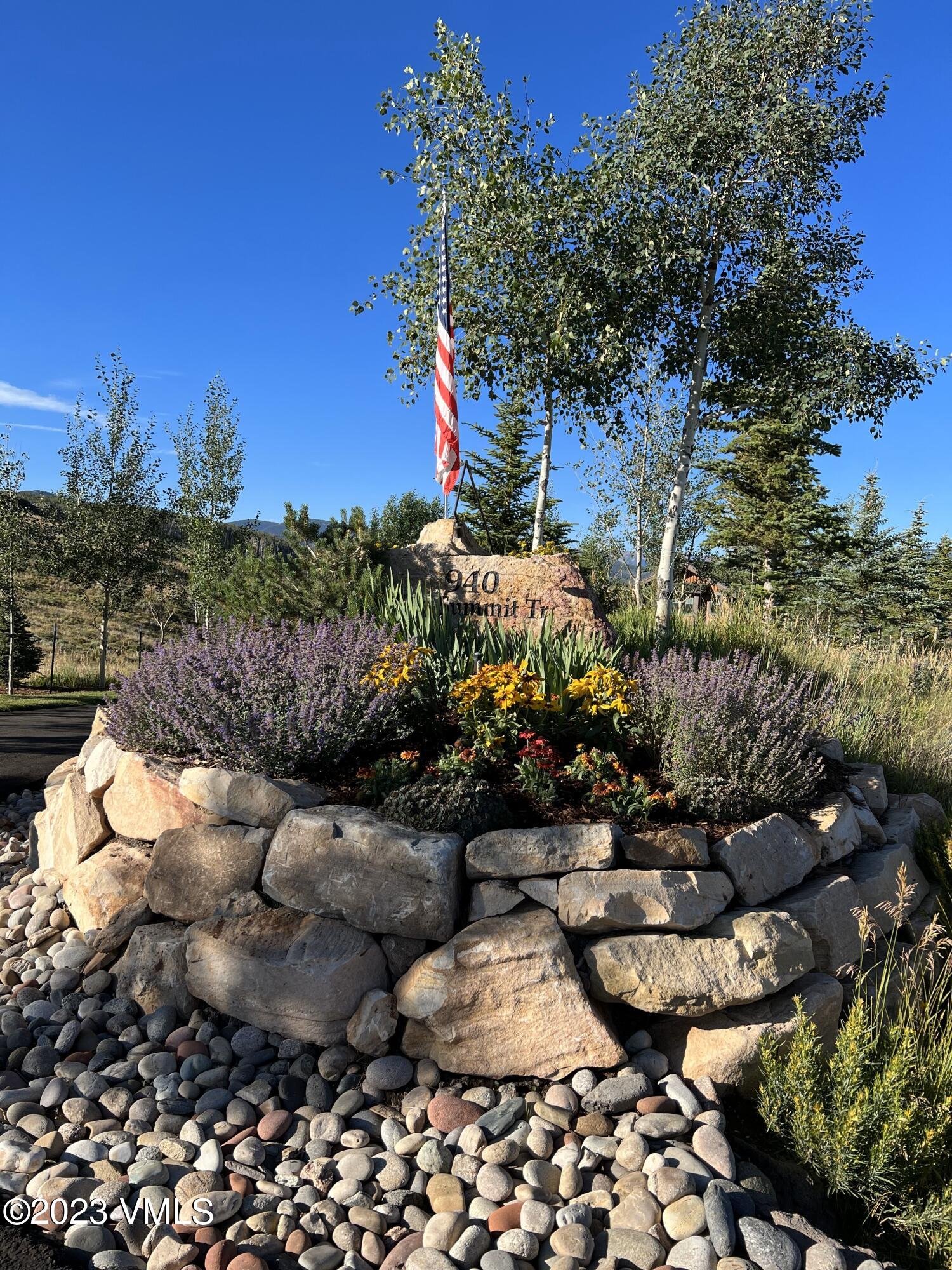 940 Summit Trail Edwards, CO 81632 - Photo 62 of 64 a view of a backyard with plants and a fountain