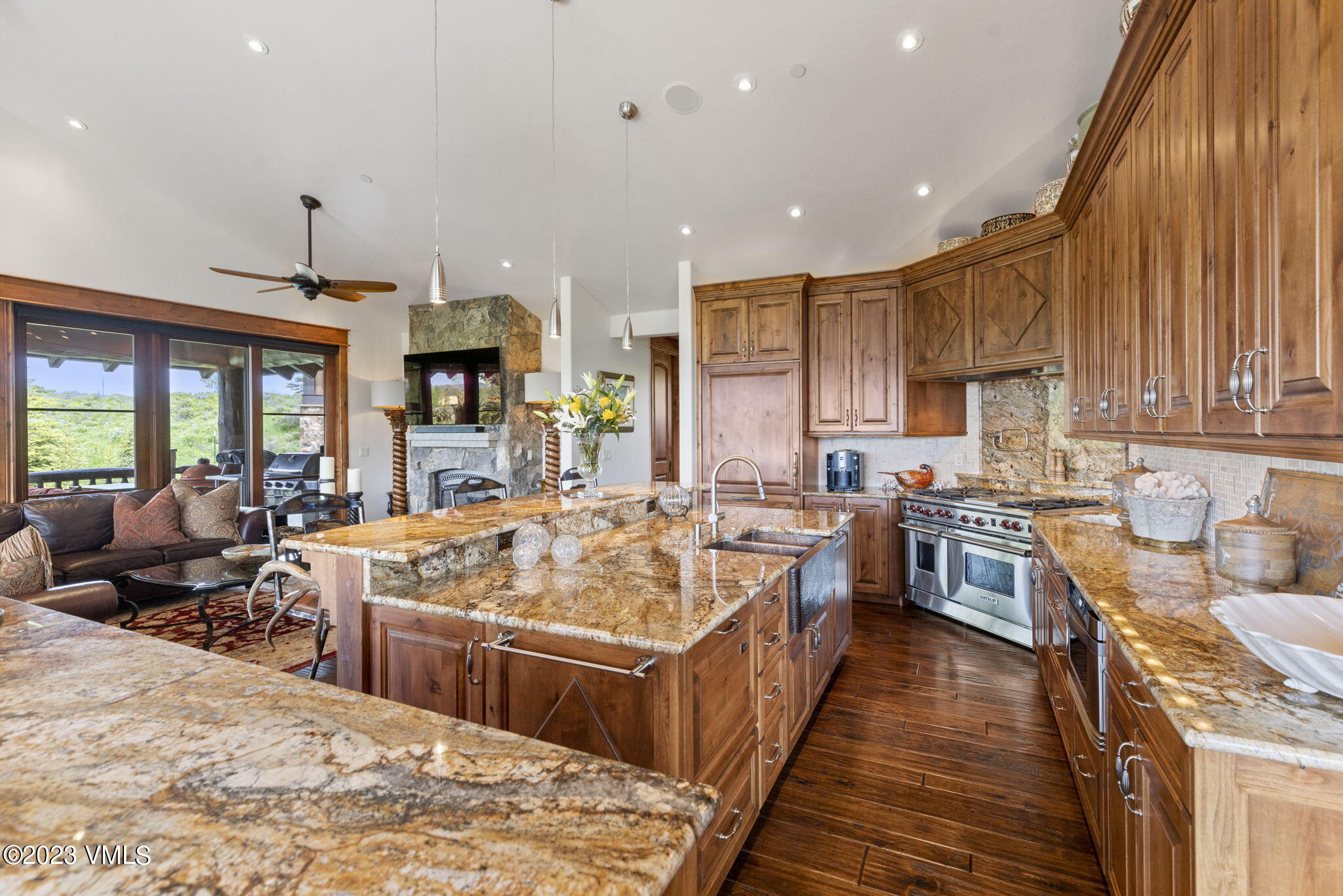 940 Summit Trail Edwards, CO 81632 - Photo 8 of 64 a large kitchen that has a lot of cabinets refrigerator oven stove dining table and chairs