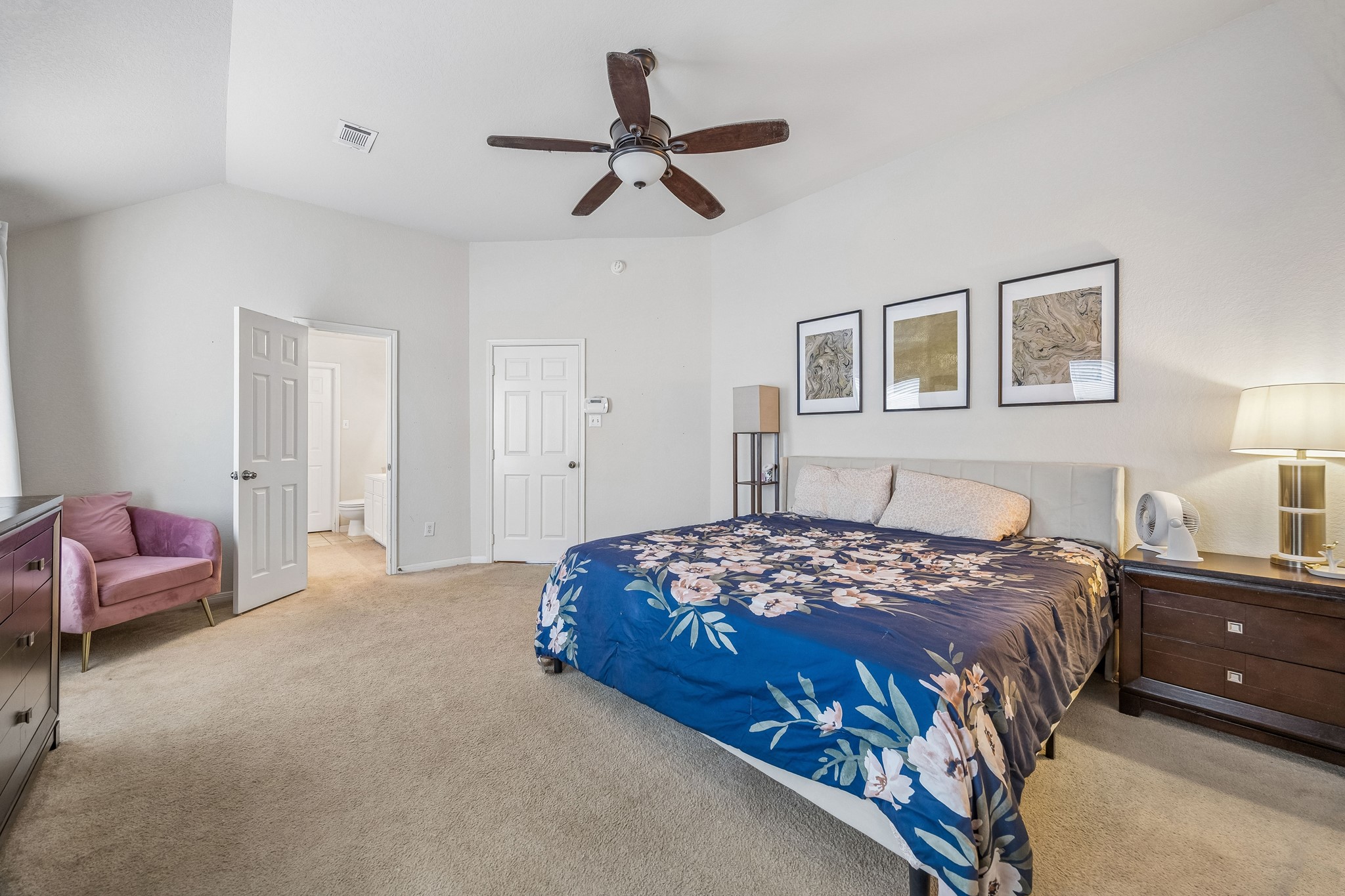 24027 Floragate Drive Spring, TX 77373 - Photo 14 of 21 a bedroom with a bed and ceiling fan