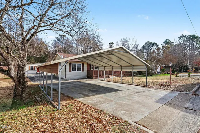 a house with trees in the background