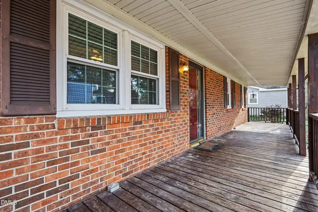 a view of a brick house with wooden floor