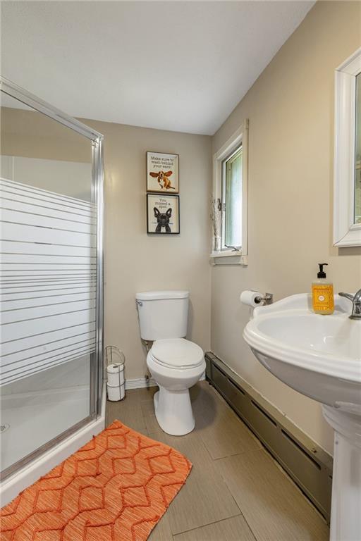305 7th Street Beaver Falls, PA 15010 - Photo 28 of 37 a bathroom with a sink a toilet and a mirror