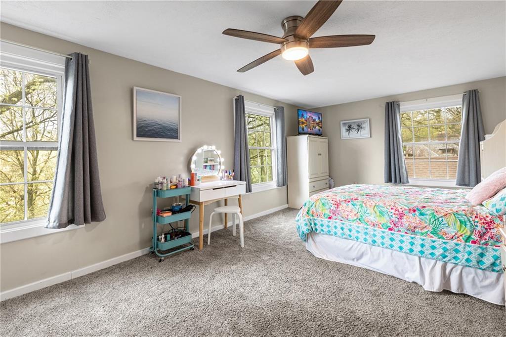 305 7th Street Beaver Falls, PA 15010 - Photo 32 of 37 a bedroom with a bed and a chandelier