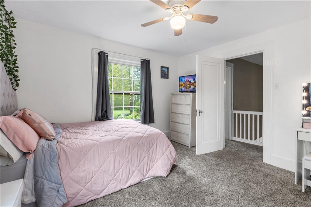 305 7th Street Beaver Falls, PA 15010 - Photo 36 of 37 a bedroom with a bed and a chandelier