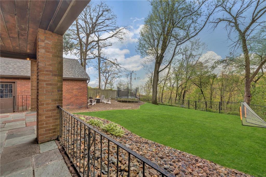 305 7th Street Beaver Falls, PA 15010 - Photo 6 of 37 a view of a backyard with brick wall