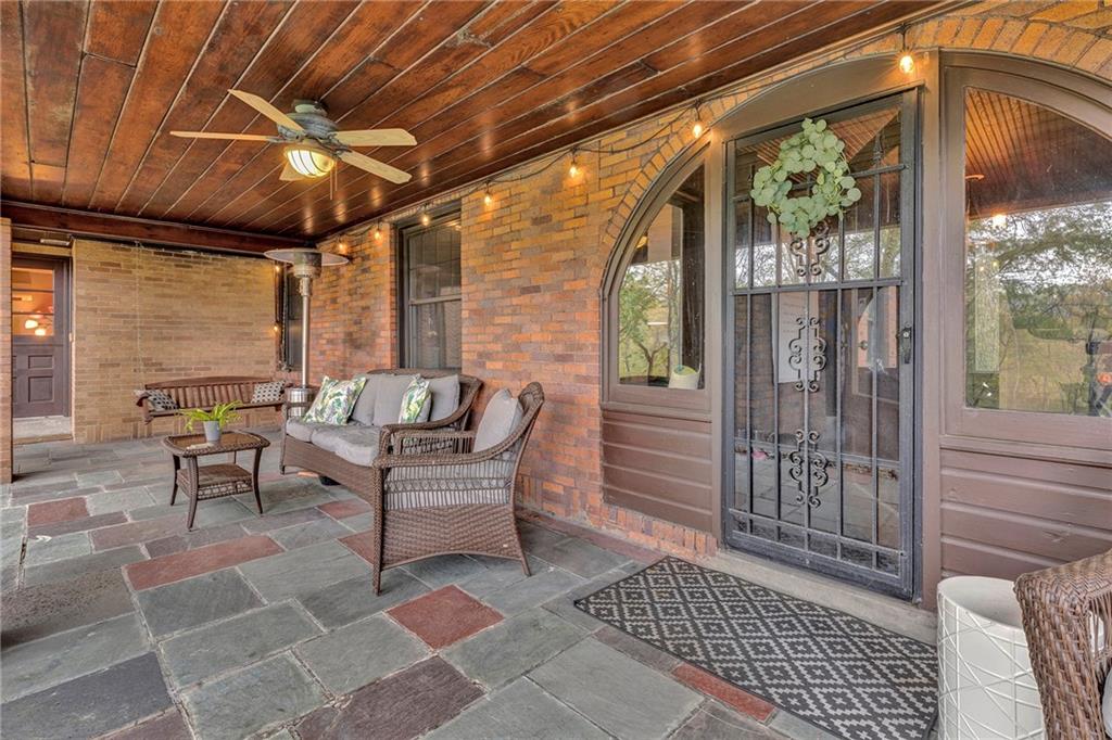 305 7th Street Beaver Falls, PA 15010 - Photo 7 of 37 a balcony with furniture and a potted plant