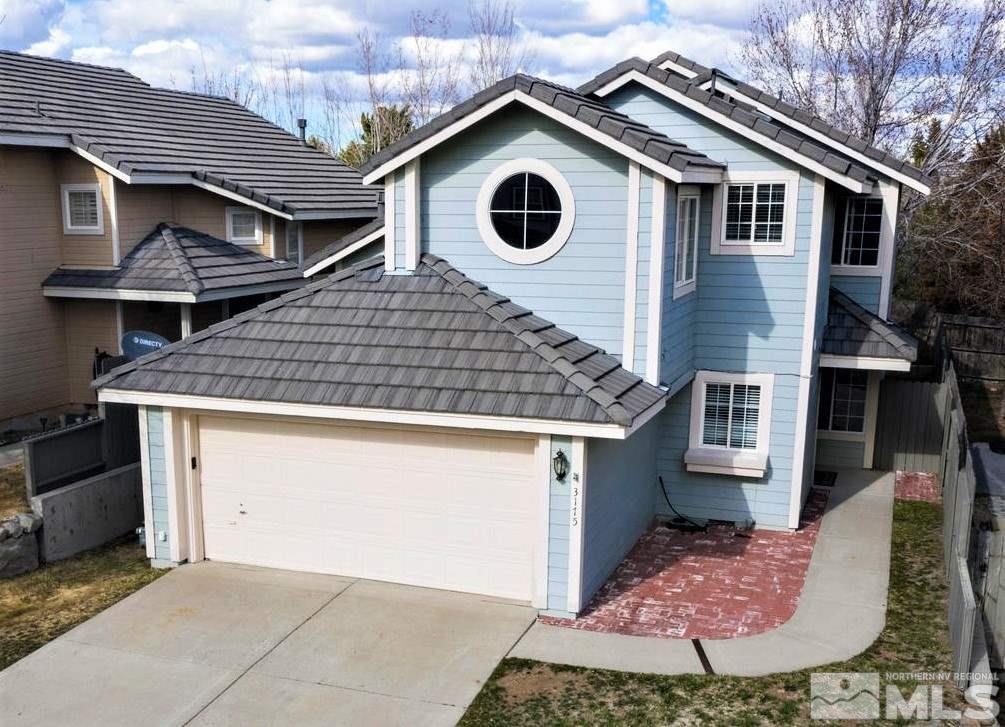 3175 Alpine Creek Road Reno, NV 89519 - Photo 1 of 25 a front view of a house with garden