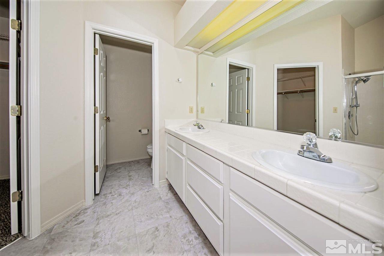 3175 Alpine Creek Road Reno, NV 89519 - Photo 15 of 25 a bathroom with a double vanity sink mirror and