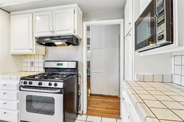 a kitchen with stainless steel appliances a stove and a refrigerator