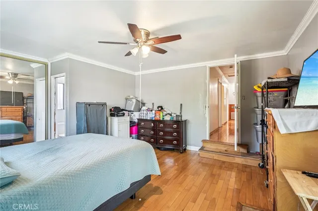 a bed room with a bed and a chandelier