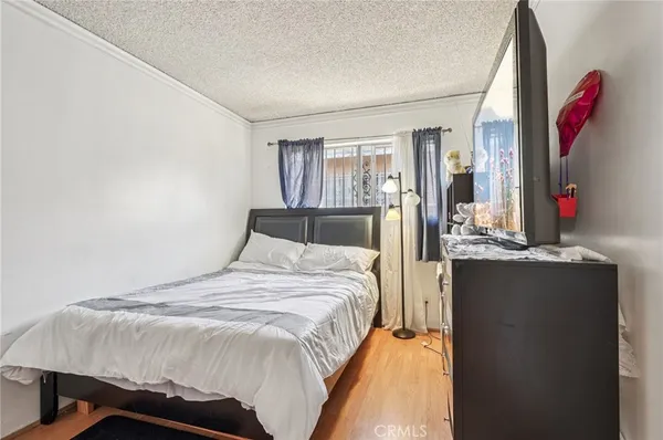 a bedroom with a bed and cabinets