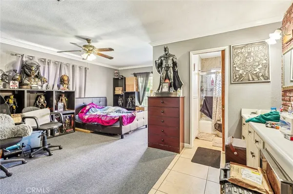 a bedroom with furniture and a chandelier