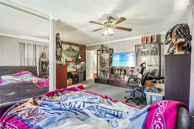 a bed room with a bed mirror and a window