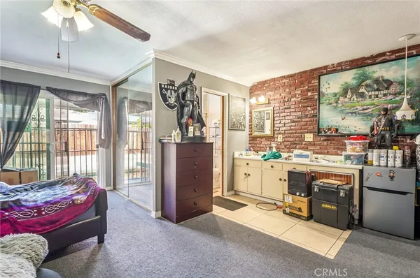 a bathroom with a granite countertop shower a toilet and a sink