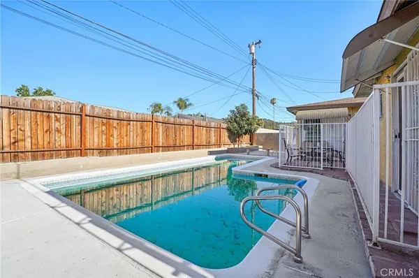 a view of a house with swimming pool