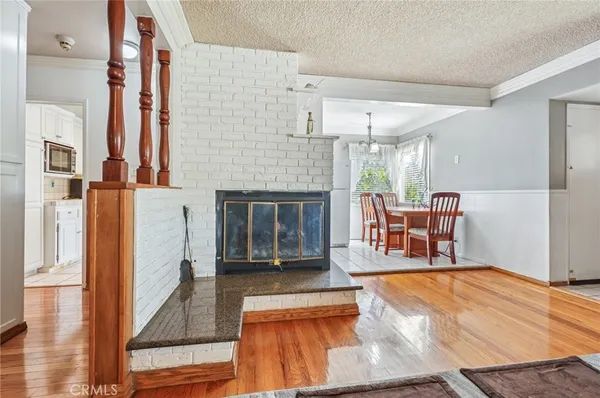 a view of a livingroom with furniture and a fireplace