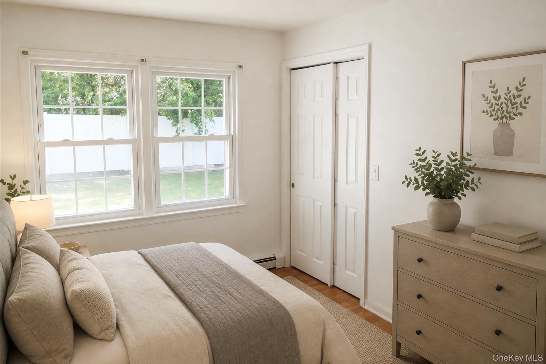 80 Mt Pleasant Road Smithtown, NY 11787 - Photo 8 of 27 a bedroom with a bed and a potted plant