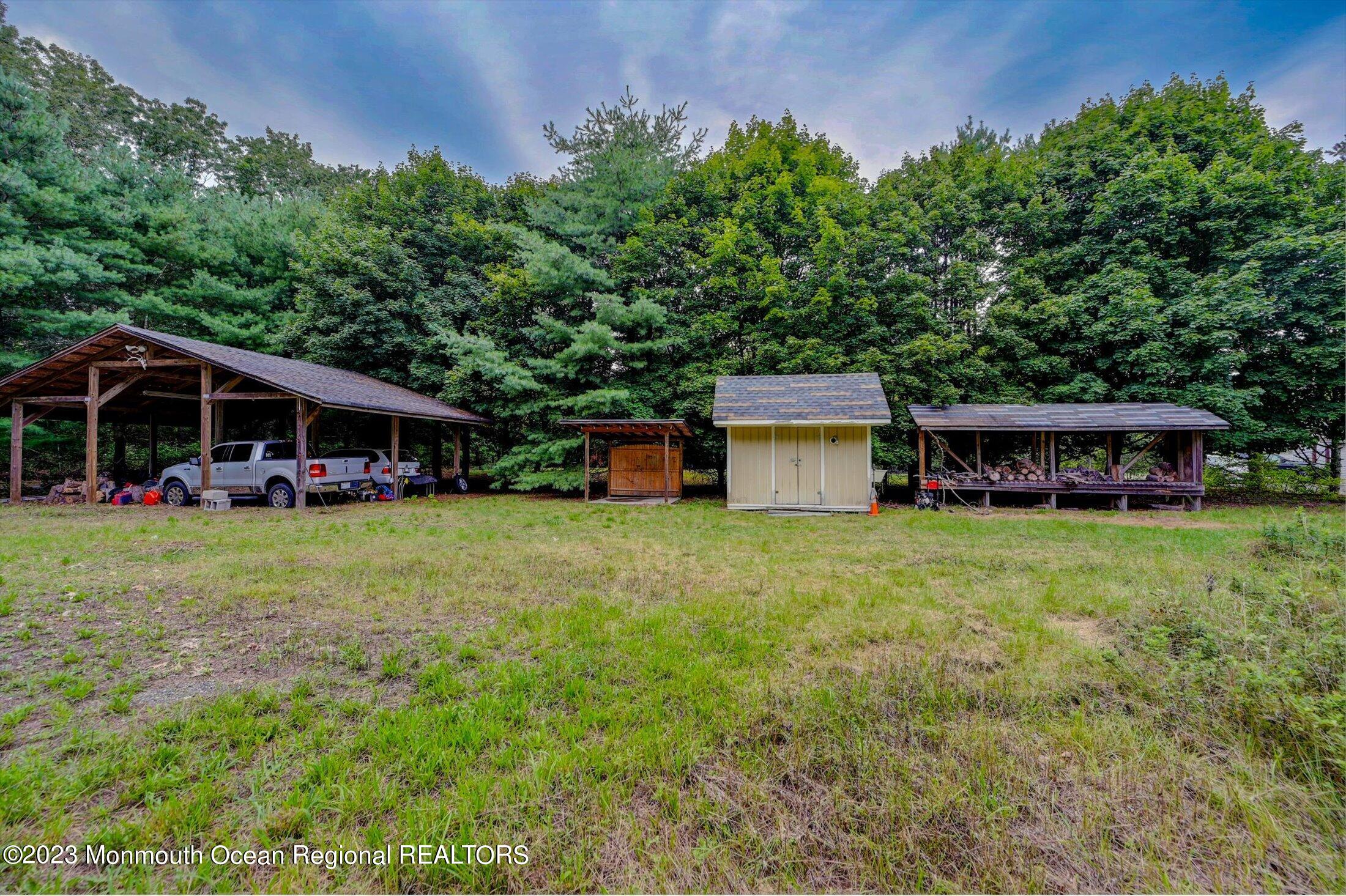 897 Fort Plains Road Howell, NJ 07731 - Photo 24 of 35 a view of a house with backyard and sitting area