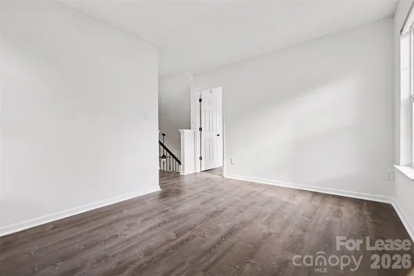 an empty room with wooden floor