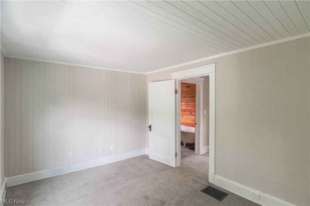 170 Avon Belden Road Avon Lake, OH 44012 - Photo 16 of 18 Empty room featuring ornamental molding and light colored carpet