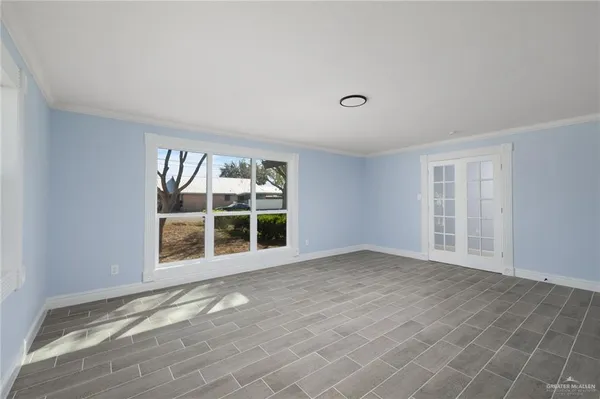 a view of an empty room with a window