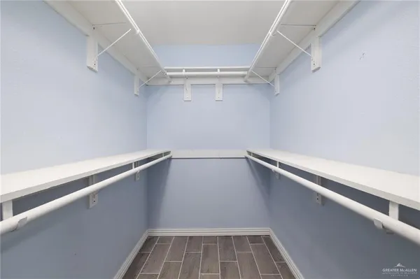 a view of an empty walk in closet