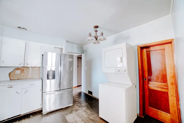 a kitchen with stainless steel appliances a refrigerator and a stove